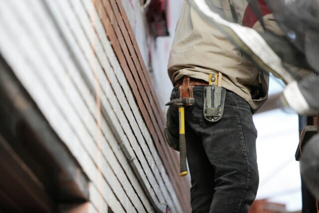 a contractor working on a home after securing a surety bond